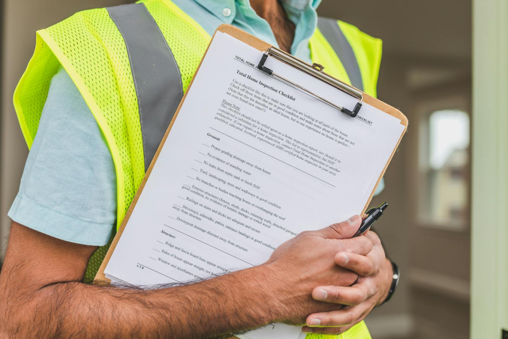 Atlanta home inspector with clipboard and checklist - pre-listing inspection guide 2026