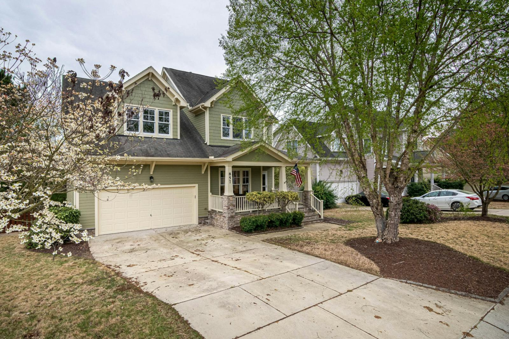 Picturesque Atlanta suburban home with lush front yard and trees - market data $400K price tier guide